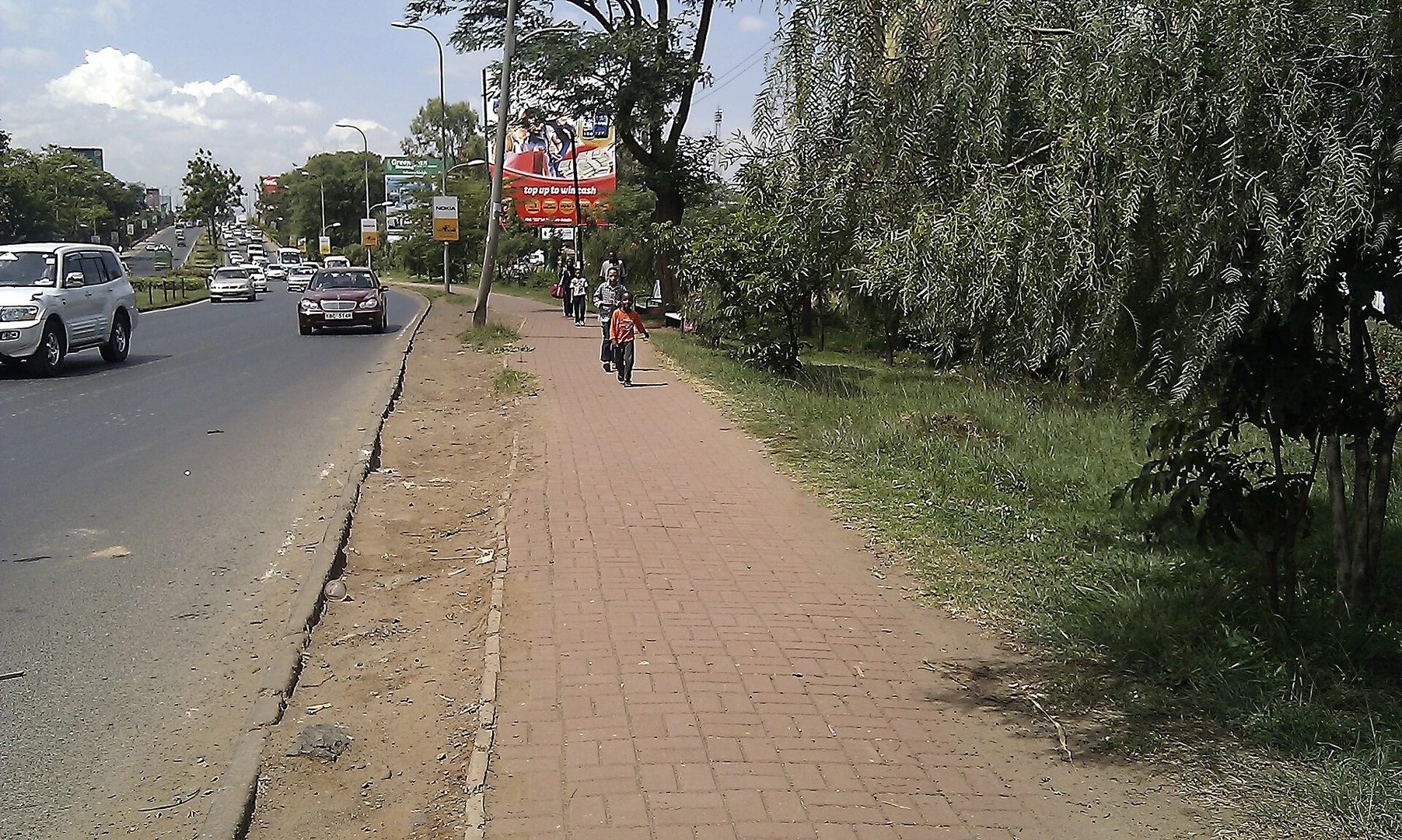 A family walking along a Nairobi street